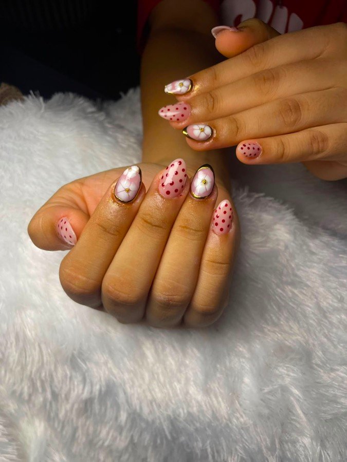 Elegant almond nails with pink floral and polka-dot art